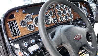 The rig’s interior is mostly stock, other than a pair of aftermarket seats and some chrome additions on the dash.