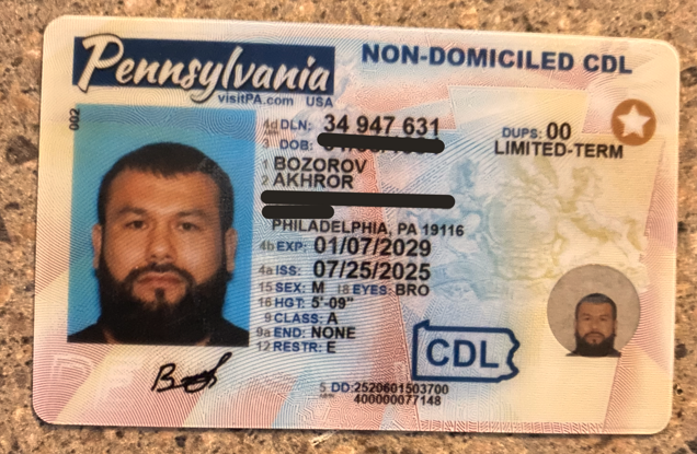 An image released by DHS shows Bozorov's Pennsylvania-issued non-domiciled CDL.