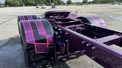 The theme extends all the way to the striped rear fenders and a purple frame.