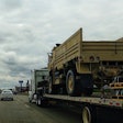 Military Vehicle On Flatbed Truck Highway