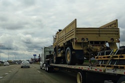 Military Vehicle On Flatbed Truck Highway