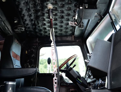 The driver wanted a tall shifter. Mann and company “started adding increments to the shifter,' he said, 'and it got to be a two-foot extension. It almost puts your hand on the ceiling.”