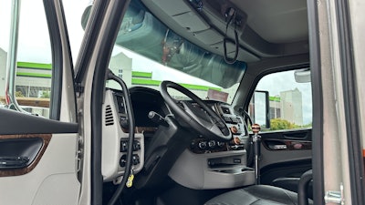 The interior is mostly stock apart from a few knobs added to match the exterior colors of the truck.