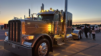 The rig features extra lights, including some amber underglow.