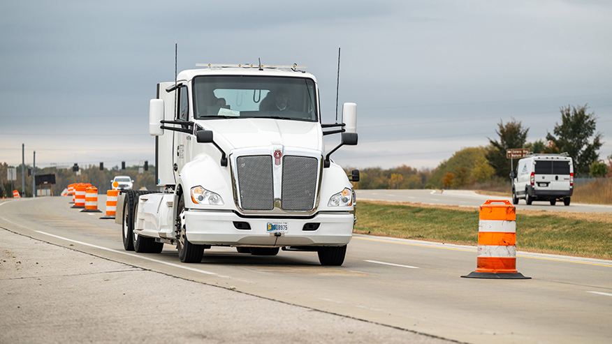 An electric heavy-duty truck provided by Cummins charges as it drives along a test segment on U.S. Highway 52/231 in West Lafayette, Indiana.