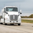 An electric heavy-duty truck provided by Cummins charges as it drives along a test segment on U.S. Highway 52/231 in West Lafayette, Indiana.