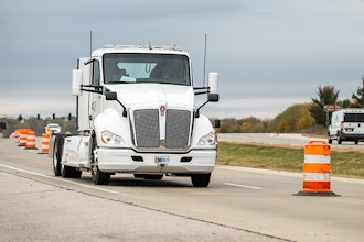 An electric heavy-duty truck provided by Cummins charges as it drives along a test segment on U.S. Highway 52/231 in West Lafayette, Indiana.