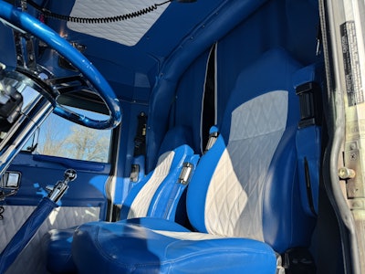 Inside the unit, the owner-operator put in a Truck’N Awesome interior kit, and he took the panels out of the interior to a local upholstery shop and had them recovered to match the sleeper to the cab. He added watermelon lights throughout, along with an upgraded stereo.