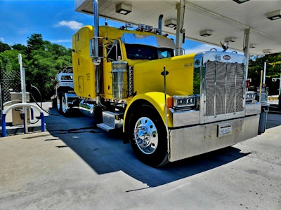 He started Top Notch hauling in a 2001 Peterbilt 379 for the first few years, then found his way into another 379 of the same vintage that he bought from a friend. He hauls in that yellow Pete today, pulling a 2016 Transcraft step deck.