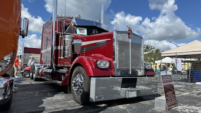 The stripe pattern is modeled after that first 1982 model he bought, except that one was black and silver instead of this unit’s burgundy, silver and gray scheme.