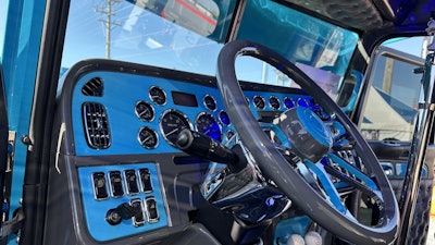 The dash is painted baby blue with gray accents, opposite of the rig’s exterior.