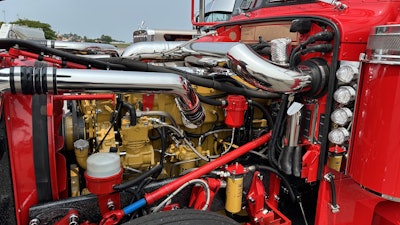 He tried to use a Dynaflex intake pipe kit, but it wouldn’t fit his truck because his engine is set back instead of set forward. He worked with B&H Tubes in Pennsylvania to build the polished stainless intake pipes.