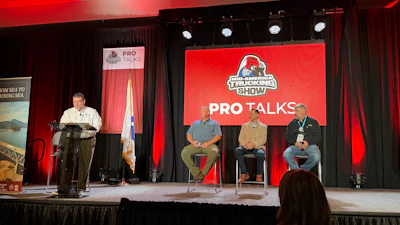 Led by Tom Liberatore (far left), FMCSA's Office of Compliance director, the panel included Ankur Saini, FMCSA's IT director (center on chairs); Shannon Chelf, a training specialist at FMCSA (left on chairs); and Lewie Pugh, the Owner-Operator Independent Driver's Association's Executive Vice President (right).