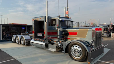 Randy Menkel and Never Satisfied Builds/J&L Contracting took home top honors in the 2026 Big Rig Build-Off at the Mid-America Trucking Show with their full-custom 1985 Peterbilt 359.