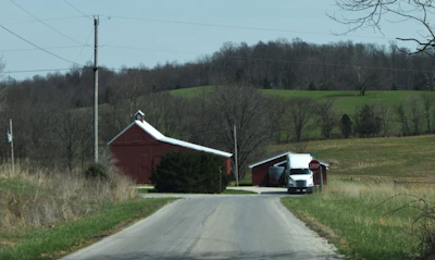 The farmhouse where owner-operator Penn has lived for a couple of decades now once belonged to his grandparents -- he bought the place after they passed. And it's more than 100 years older than the 2019 Freightliner Cascadia you see parked up ahead of the hay barn for his cattle, and another, similarly-spec'd Cascadia not visible in the image he keeps as a spare.