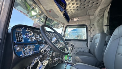 The interior features the same silver and blue color scheme as the rig's exterior.