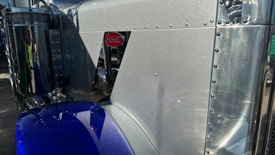 He kept silver as the primary color, but to incorporate blue, he swapped out the standard polished aluminum front fenders on the 379X model for painted blue fenders.