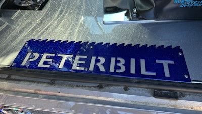 The sawblades were originally key hangers that Whittmore shaved the hooks off of and painted to match the truck.