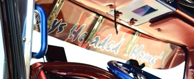 Small fleet owner C.G. Soza once named a power unit 'Always Headed Home,' painting the legend on the backside of the visor as reminder.