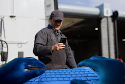 Hacker Gloves On Keyboard Id Fraud Trucker Reading Phone