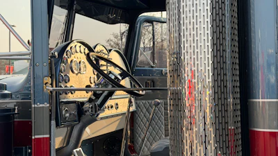 That custom dash features chrome gauges and switches.