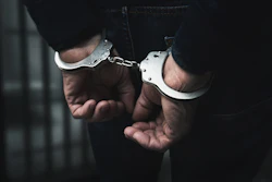 Man In Handcuffs Adobe Stock 309900017