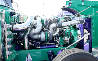 Because of the body drop, he had to put in a shorter radiator. He also added an expansion tank that's split for half to hold water and the other half power steering fluid for the power steering pump.