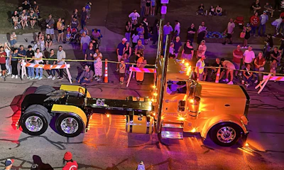 The bright-yellow day cab wouldn’t be Argumaniz’s first choice of paint color, but he said he enjoys driving this one. You can't miss it, anyway. The rig is shown here rolling through downtown Denton, Texas, during the annual Pride & Class Parade.
