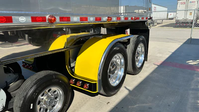 The 389 is coupled to a 2025 Mac end dump that features matched fenders.