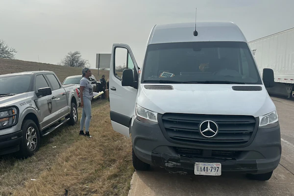 From the roadside the day of the seizure, Smith is shown in communcation with enforcement next to the couple's Sprinter.