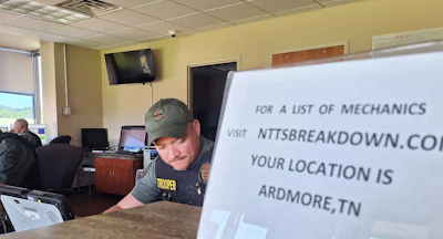 Trooper Freddy Hart (center) inside the scale facility building off I-65.