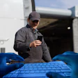 Hacker Gloves On Keyboard Id Fraud Trucker Reading Phone
