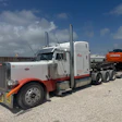 Robert 'Rocket' Miceli hauls heavy and specialized freight with this 2004 Peterbilt 379. This photo was taken when he picked up the Hitachi excavator stolen while his truck was in the shop for an engine repair.
