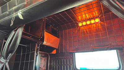 The upholstery has silver stitching to match the exterior of the unit.