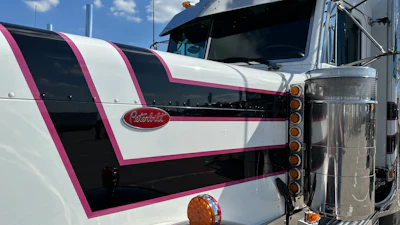 Castaldi chose white as the primary color of his paint scheme almost out of necessity to keep temperatures down inside the truck, running between Florida and the Southwest. Plus, 'I like the way ... the magenta and the black kind of go together,' he said.