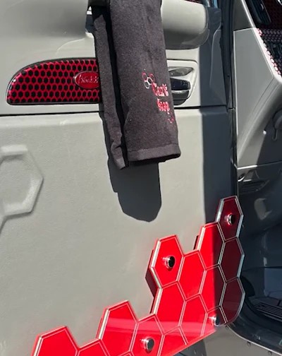 Custom hex treatment served architectural purpose in some cases, including here on the lower driver side door pocket.