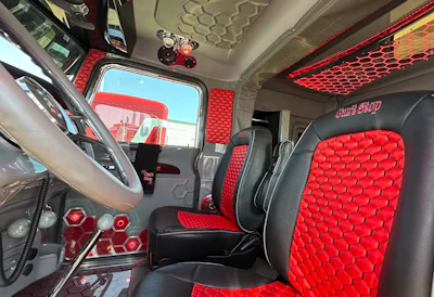 'What you see outside is what you see inside,' said Basse. He lauded the EZ Pete Interiors work that had recently completed at the time of the Pride & Class parade and attendant show for Peterbilt employees. Part of that work you see here. Hex patterns are featured on the dash and in the upholstery, the floor and cab ceiling.