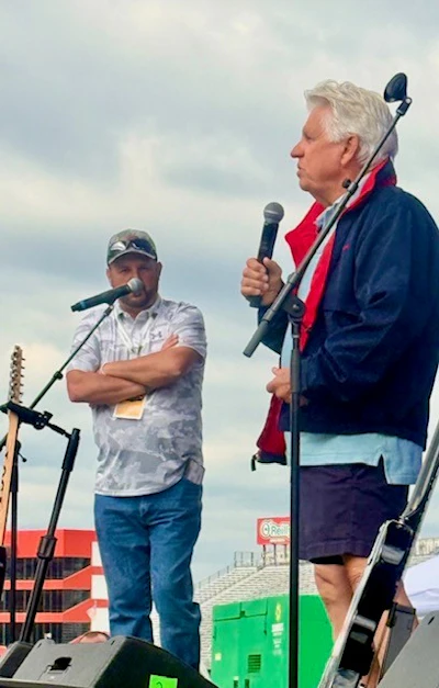 Mike Brown, pictured onstage with host Tony Justice, then pointed up. “I can’t get that done, but God can,” he said.