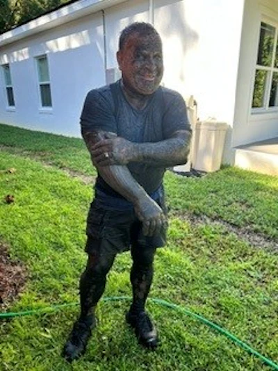 Owner-operator Dotto here is pictured after a day spent up under the KW and step deck with a pressure washer.