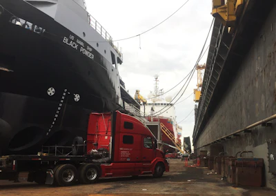Grantham and company would actually purchase Dotto's previous tractor and one of his step decks, pictured here when still under GIG's ownership. The load there was quite a memorable one for Ruben and Michelle, then teaming -- a big tranmission part for the pictured ship in a Gulf Coast dry dock.