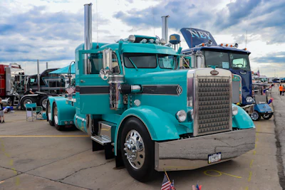 1st: Mark & Teri Lancaster of Ottumwa, Iowa, 1967 Peterbilt 358M, “Keepin’ It Teal”