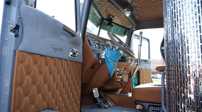 The interior, including the dash, was wrapped by a company out of Quebec. The floors feature Lightnin Jack sea deck flooring.