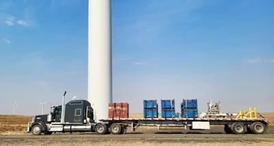 Among memorable deliveries Dee's made with his current 2013 Kenworth is this flatbed load bound for the windmill site shown.