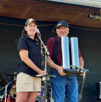 Gray, who currently serves at Secretary/Treasurer for the show’s nonprofit board, on the stage with Wek after presenting the trophy.