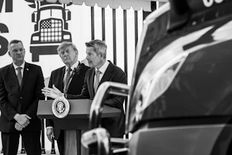 Three men in suits at podium with Presidential Seal during formal event with truck illustration backdrop