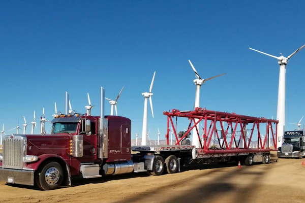 Nine-truck KST logistics moves with step deck and extendable flatbed trailers with a variety of freight on the hook, including loads like these for regional utility customers in their California home base.