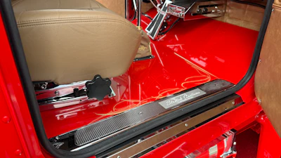 They painted the floors and dash red to match the exterior.