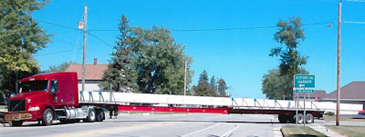 Otto's stretch trailers make far-overlength freight a possibility, too, like this load, shown carefully being maneuvered through city streets.