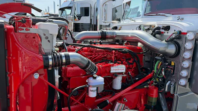 The rig is powered by a Cummins X15. The entire engine and engine bay have been painted to match the truck's theme.