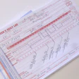 Completed driver's daily log form with handwritten entries tracking hours and vehicle information